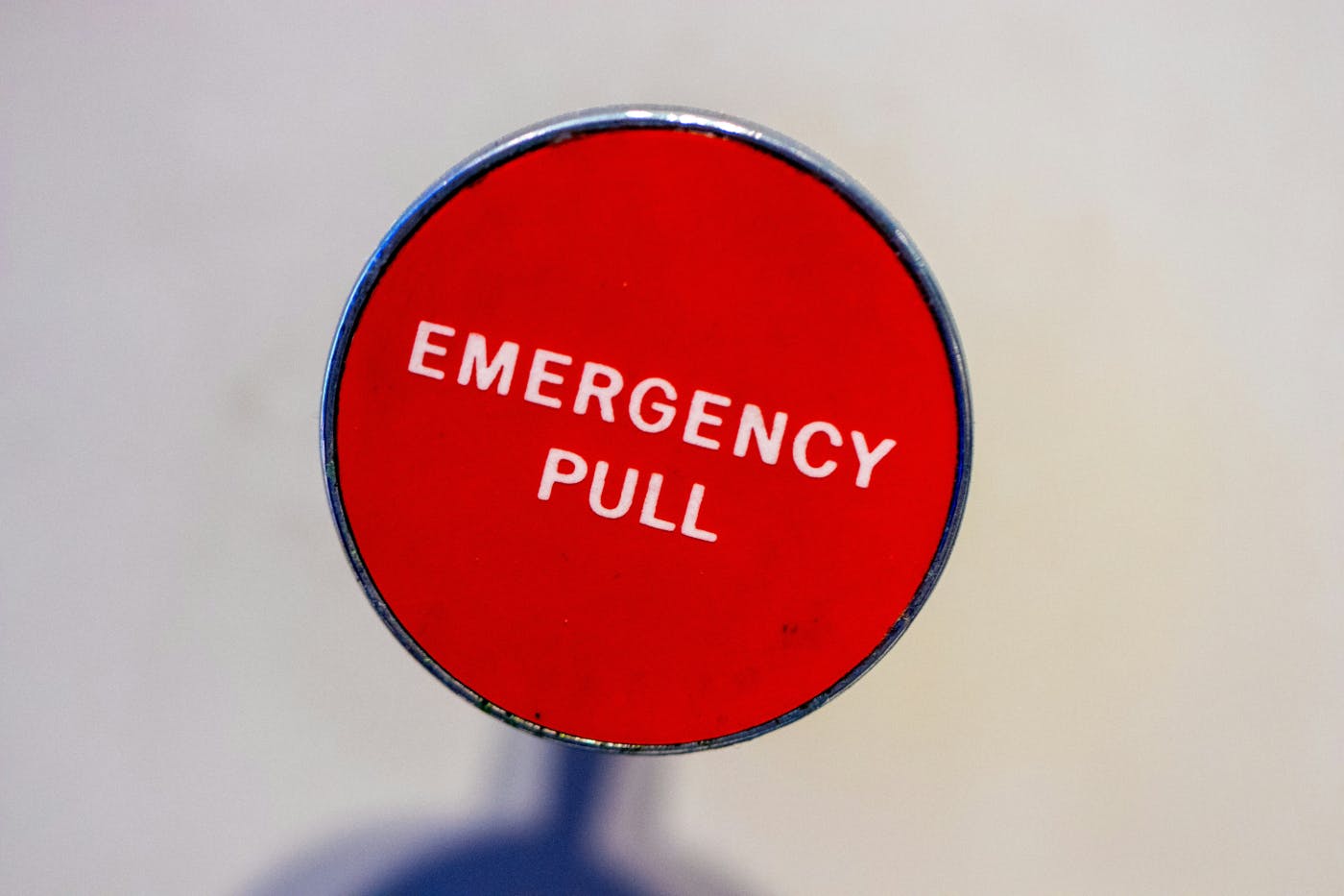 A red emergency pull lever