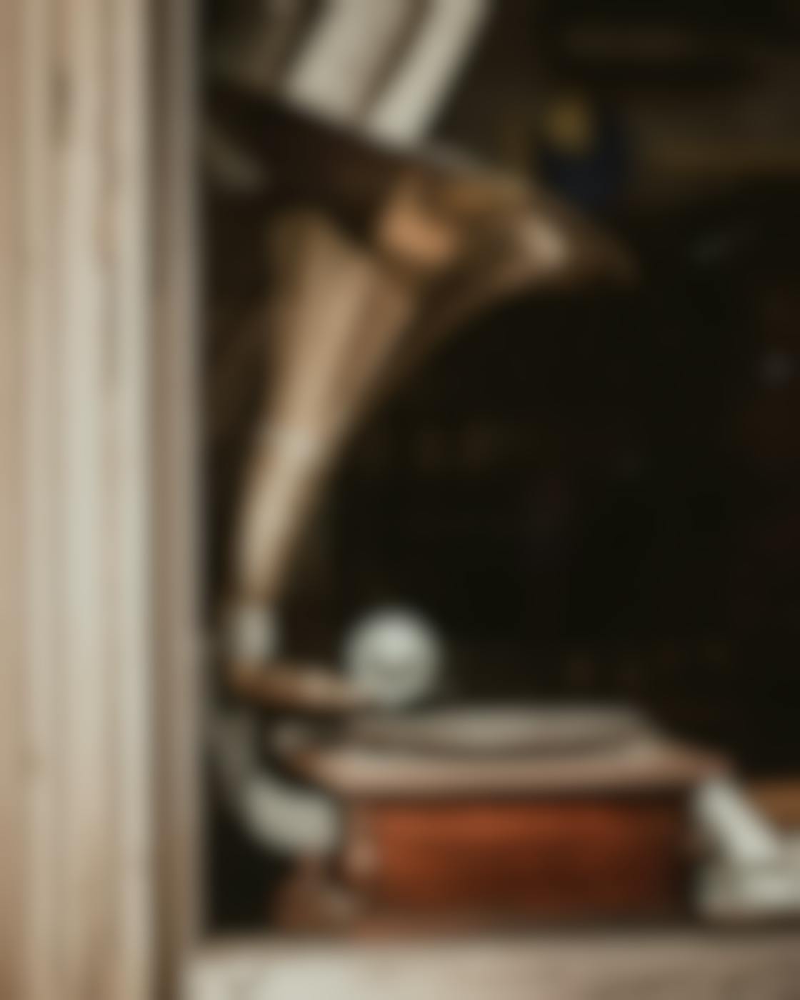 An old fashioned record player in a window