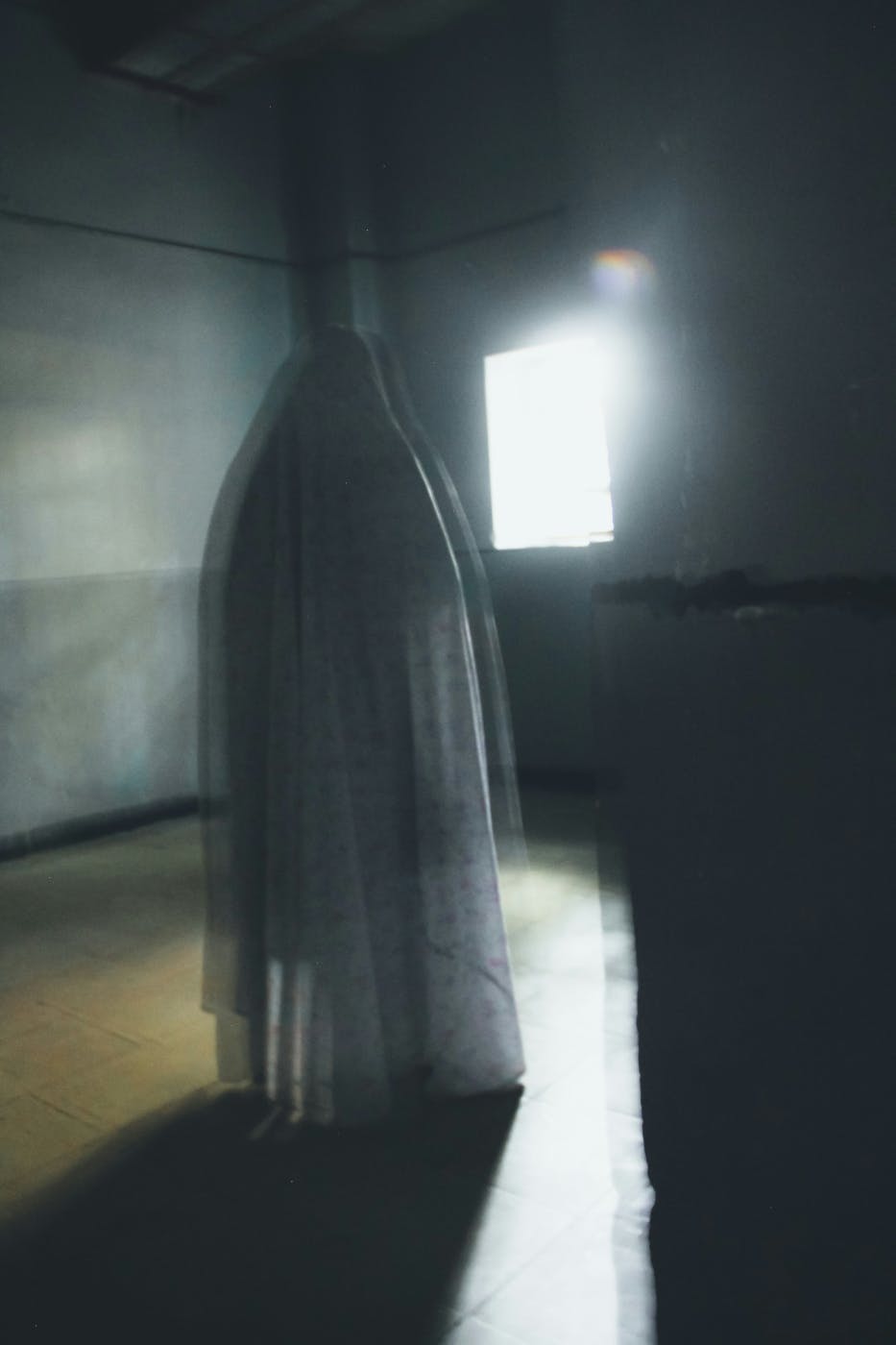 A ghostly image in a dark room