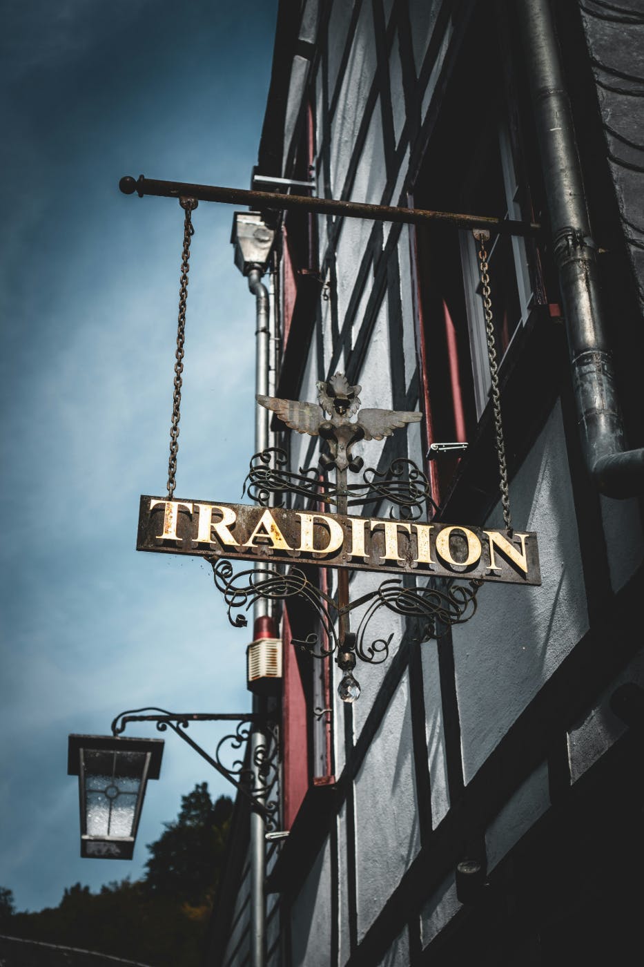A sign on a shop reading Tradition