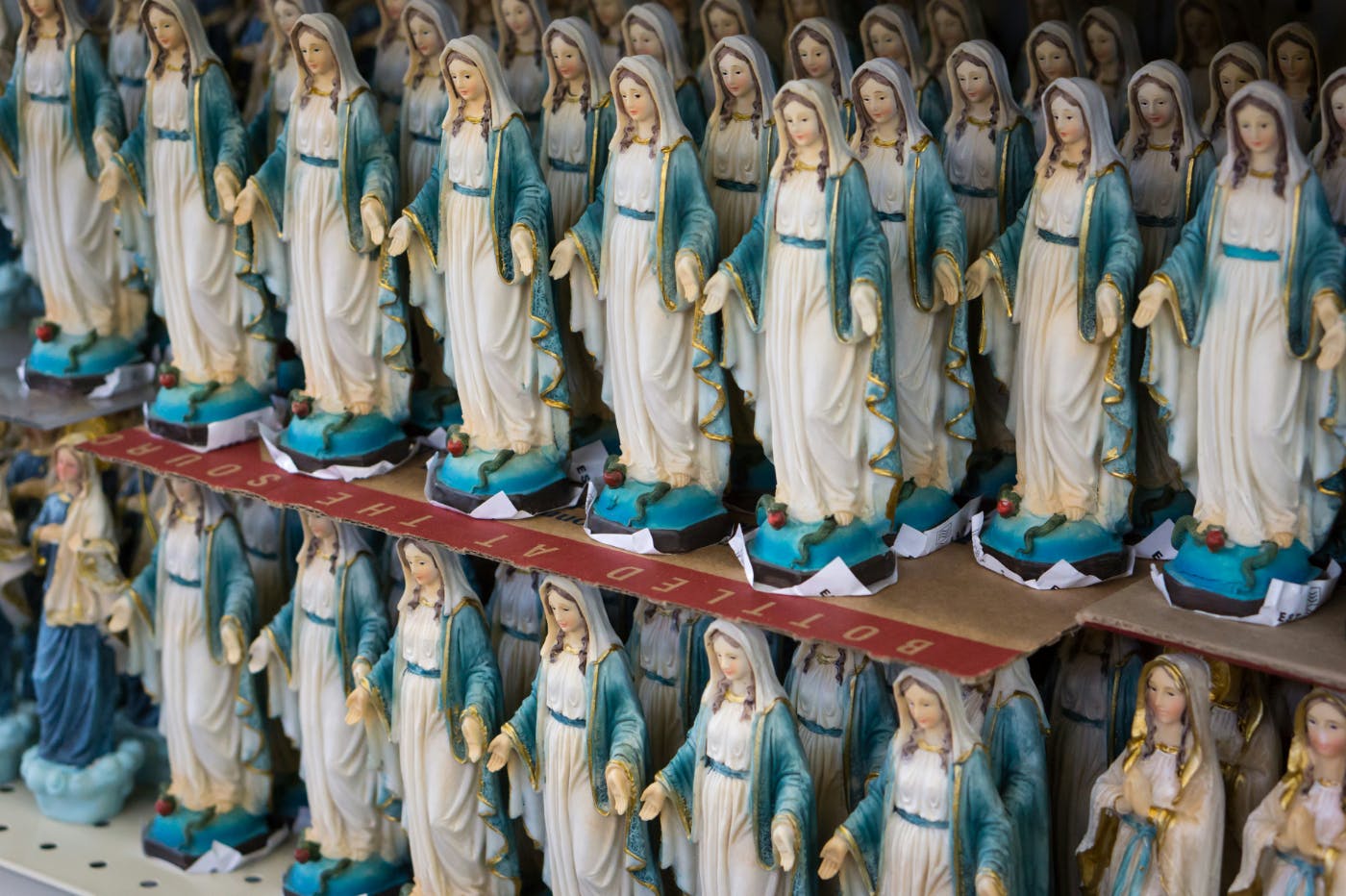 Shelves with hundreds of statues of the Virgin Mary