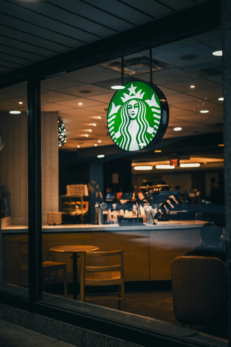 A Starbucks shop window with the massive logo sign