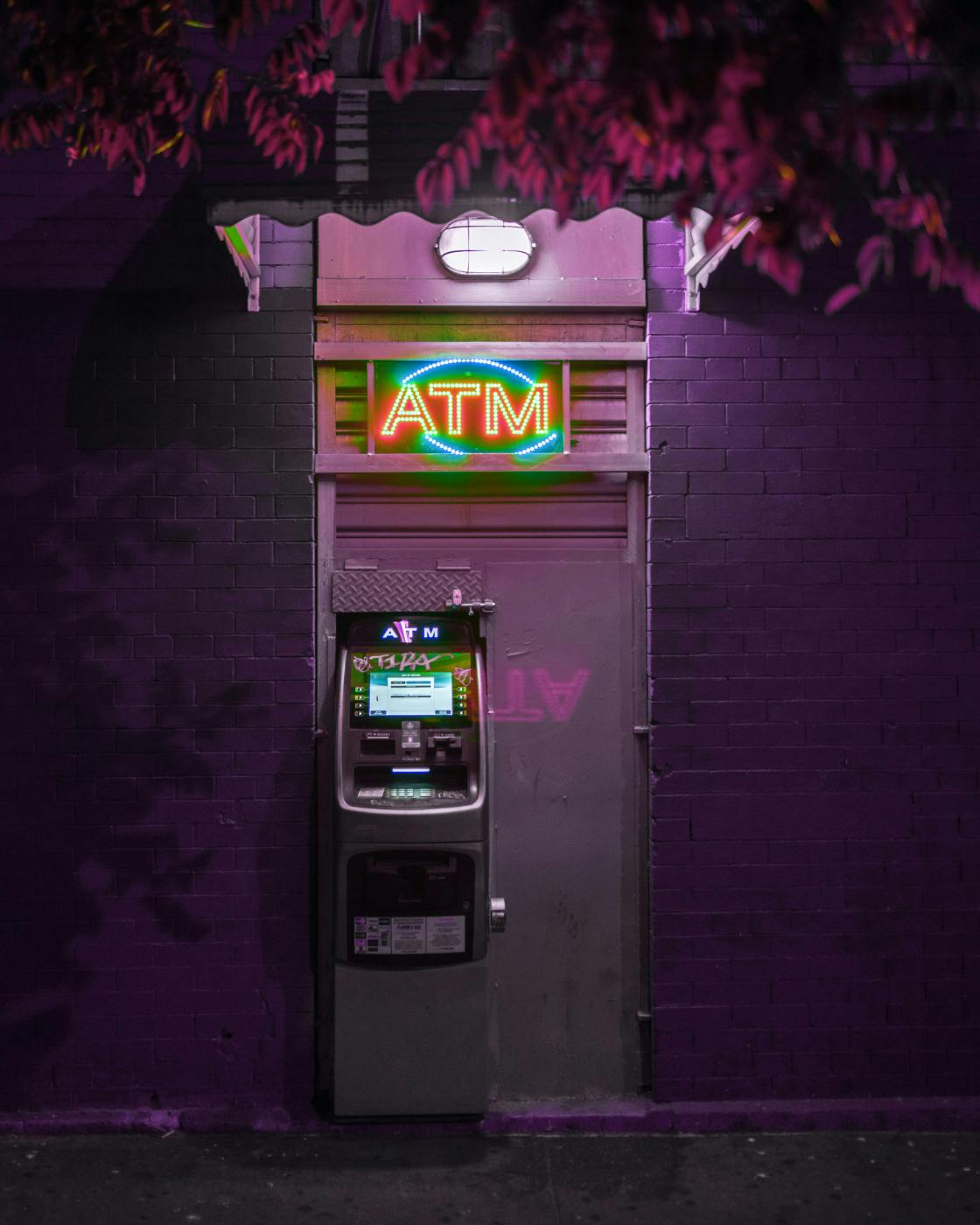 An ATM under purple light