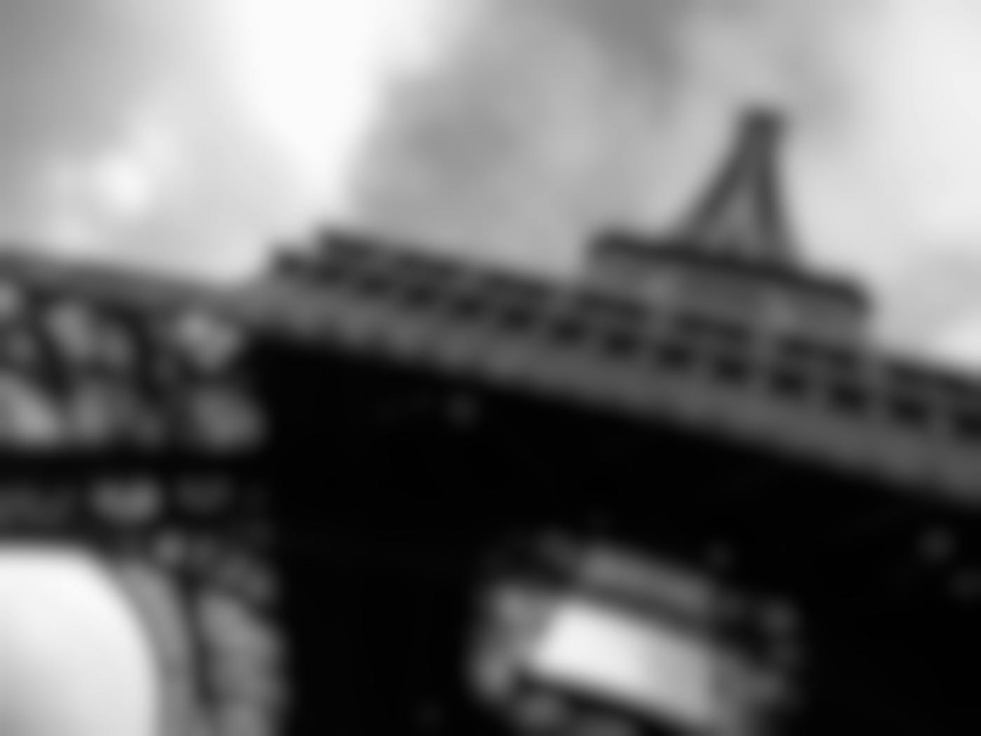 Black and white photo of the Eiffel Tower from the bottom up