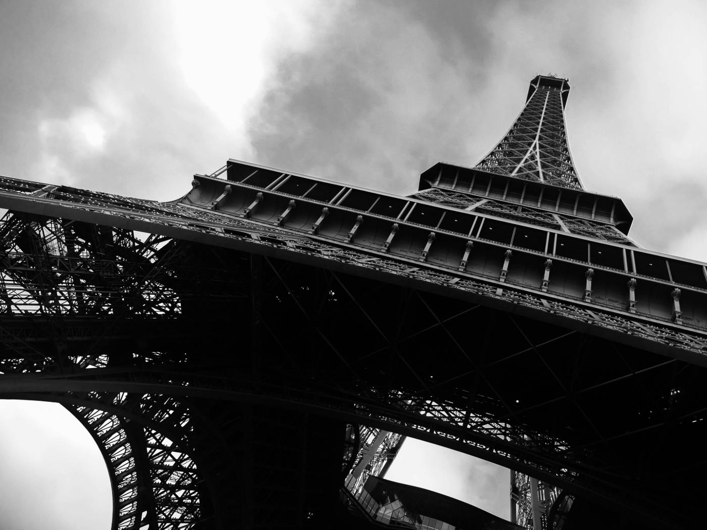Black and white photo of the Eiffel Tower from the bottom up