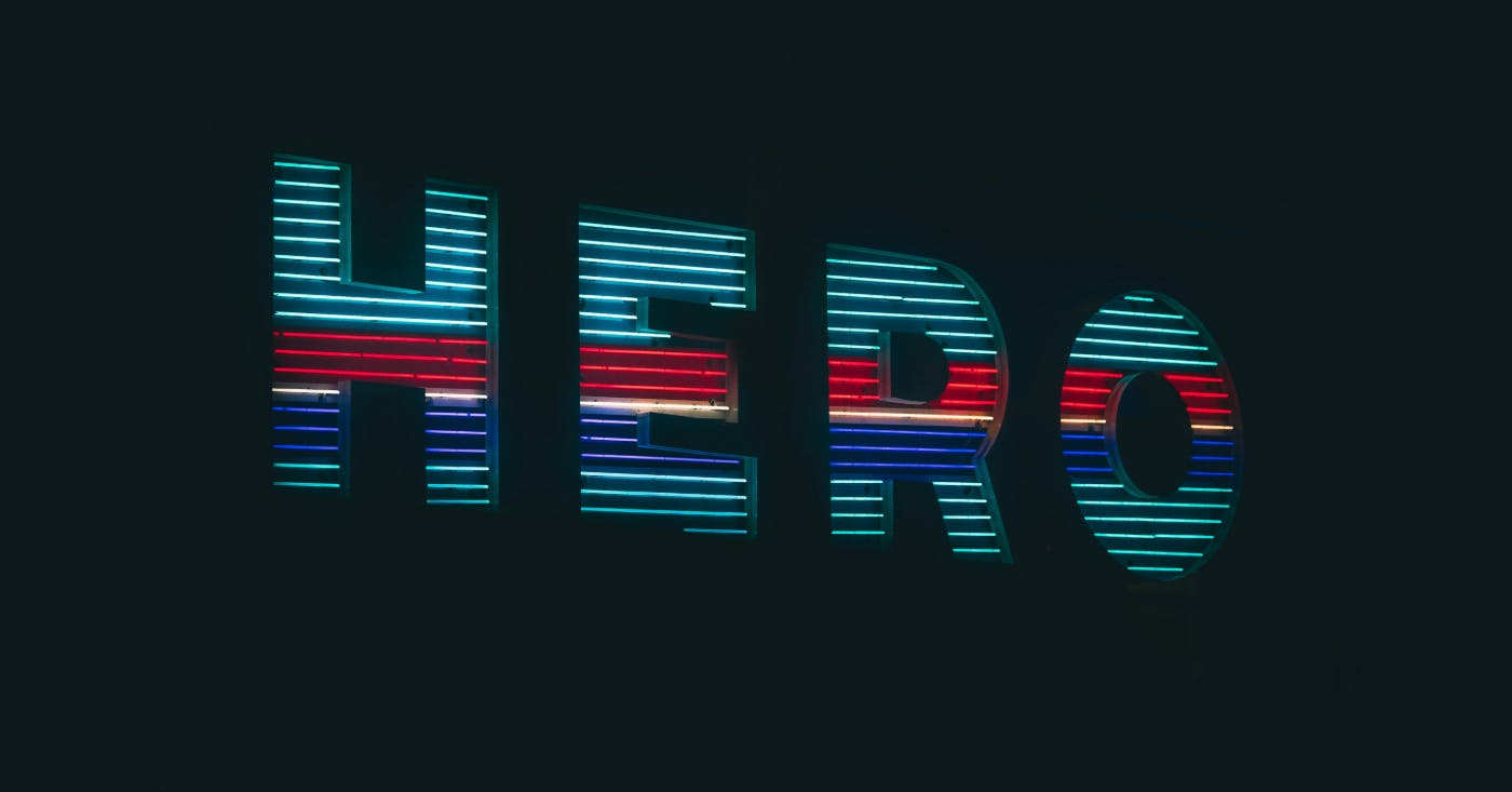 The word hero in multi colored lights