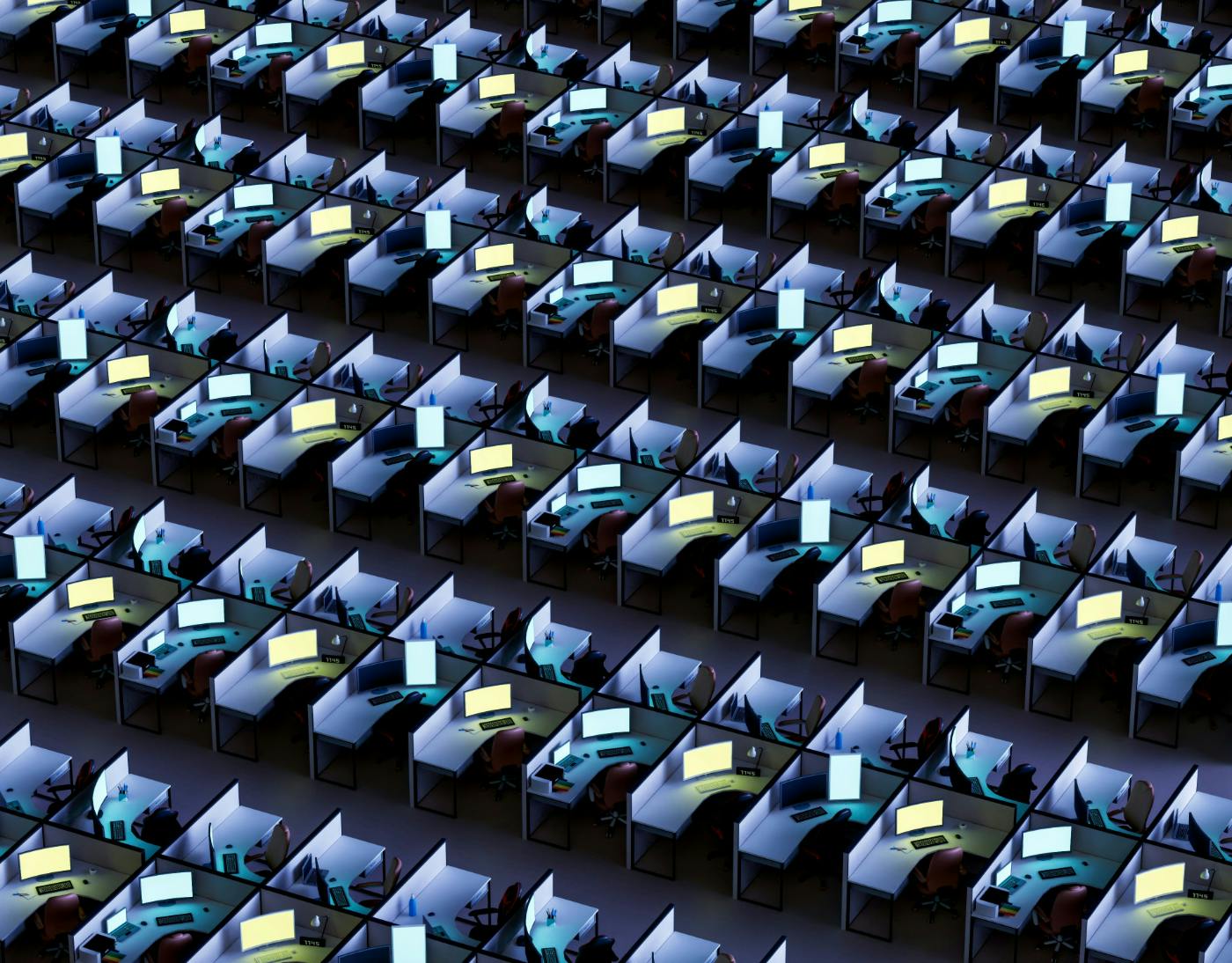 Thousands of cubicles with lit monitors
