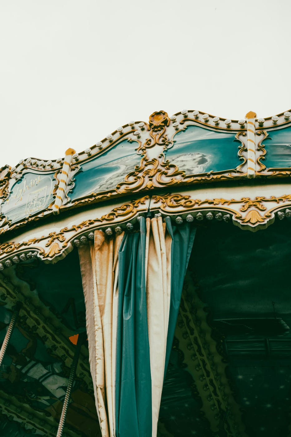 The curtains and filigree of a defunct carousel