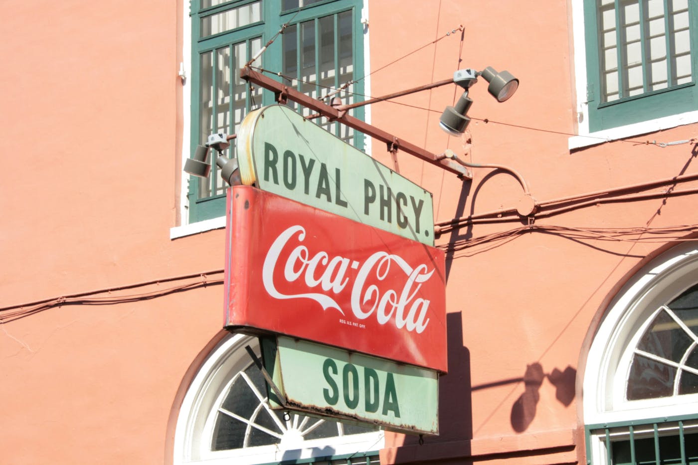 A classic coca-cola sign outside the Royal Pharmacy