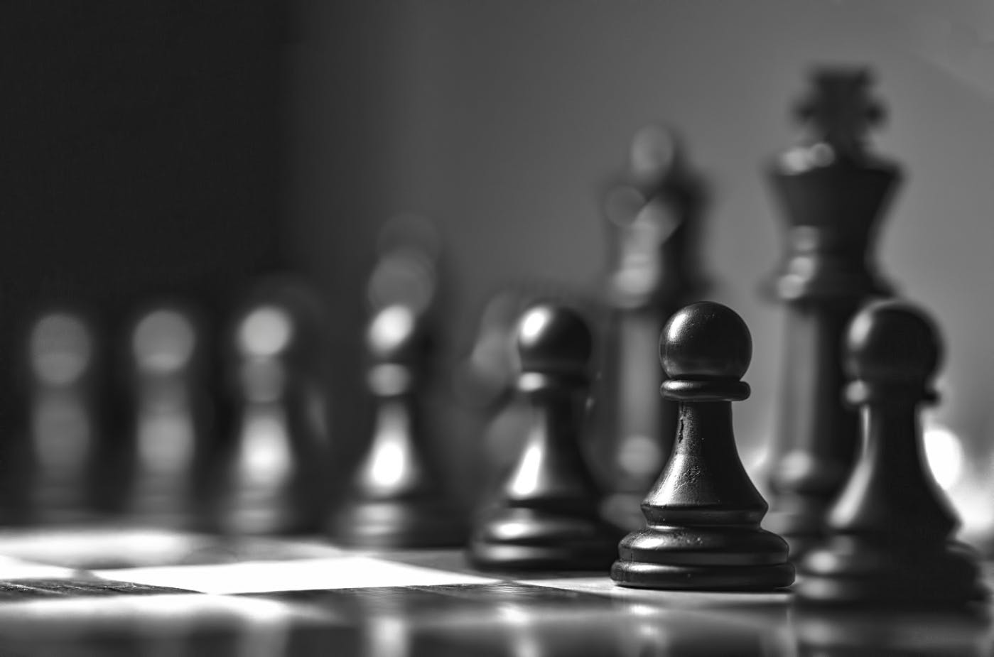 Black and white of the black pieces on a chess board