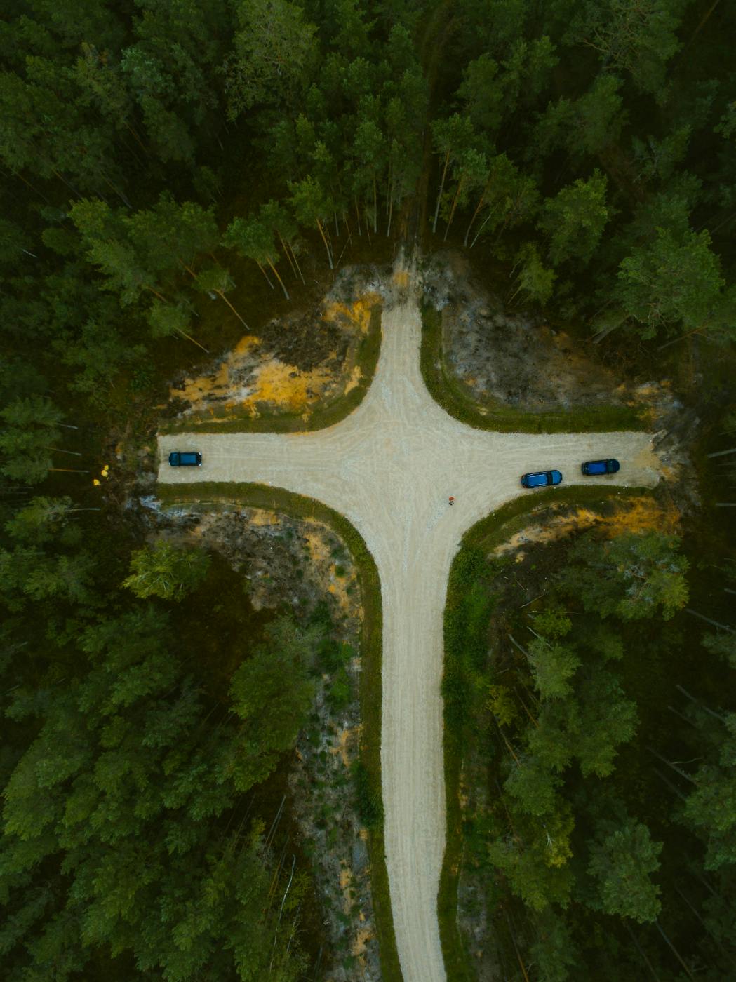 an Ariel view of a crossroad in the woods