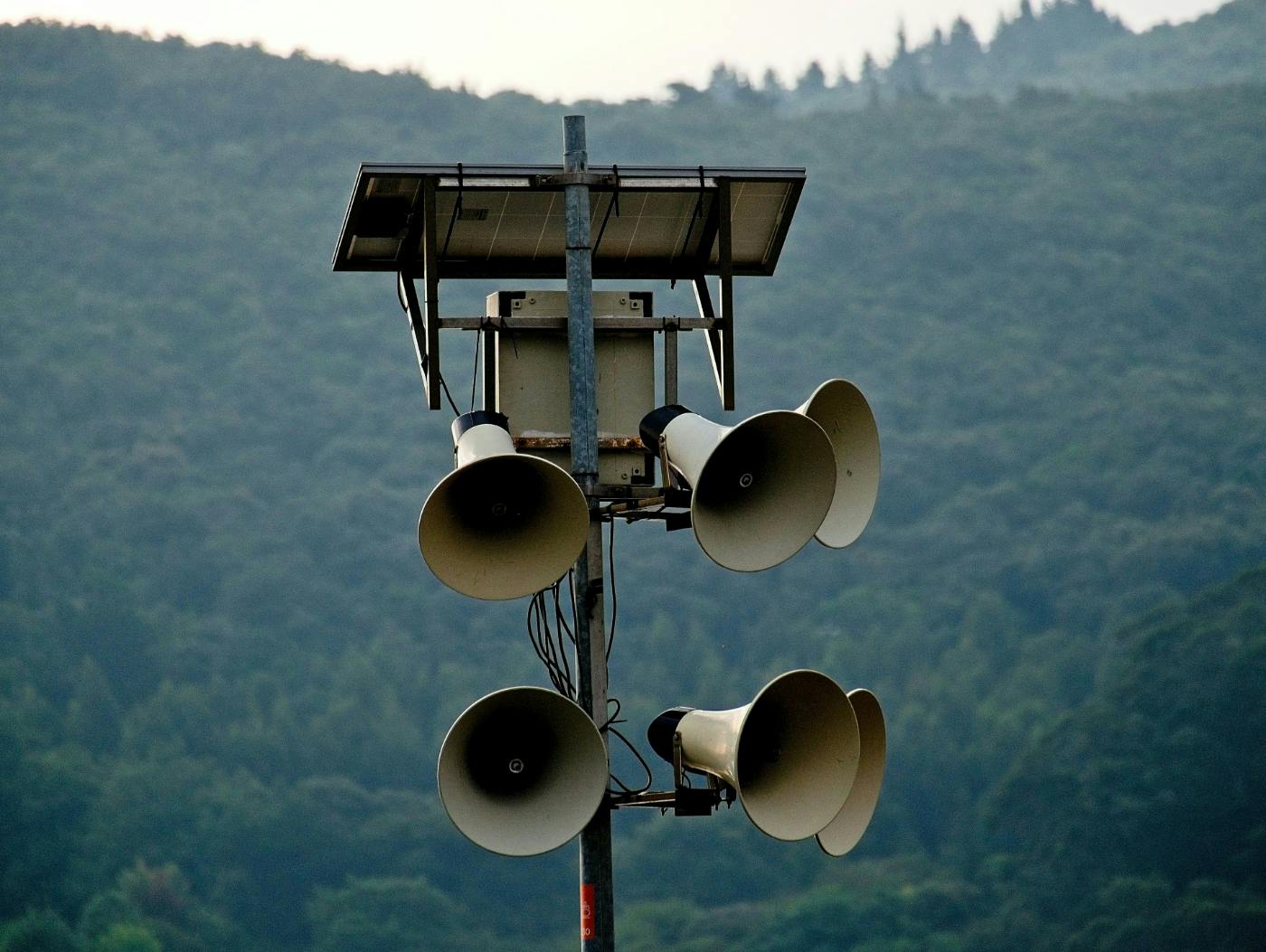 A makeshift communication tower with 6 bullhorns