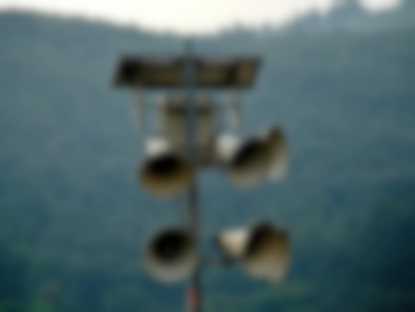 A makeshift communication tower with 6 bullhorns