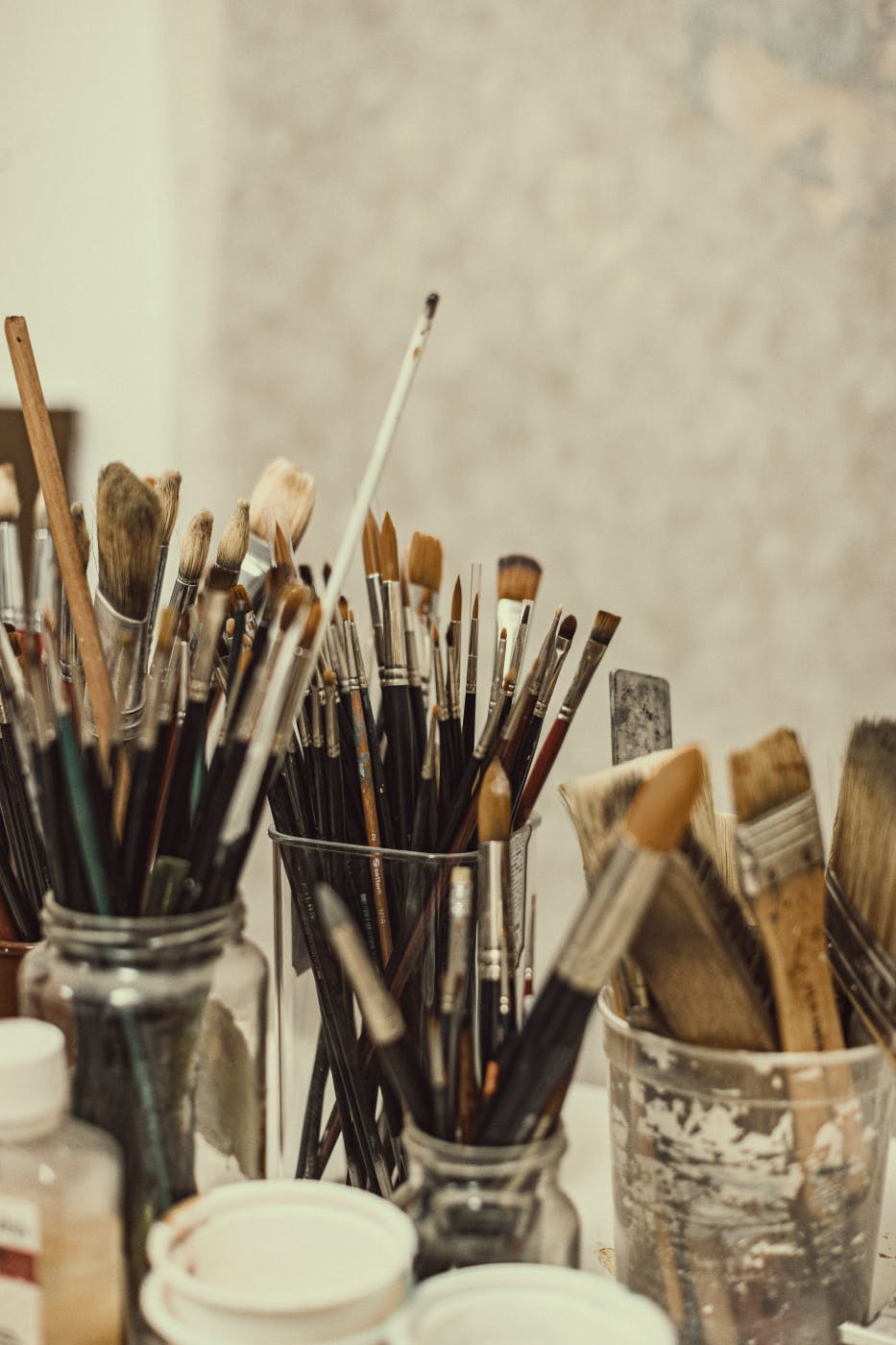 Jars filled with clean paint brushes