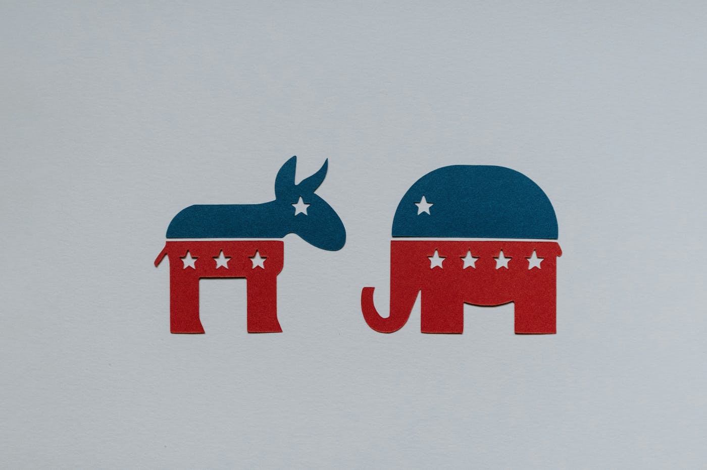 A picture of a donkey and an elephant with red and blue and stars