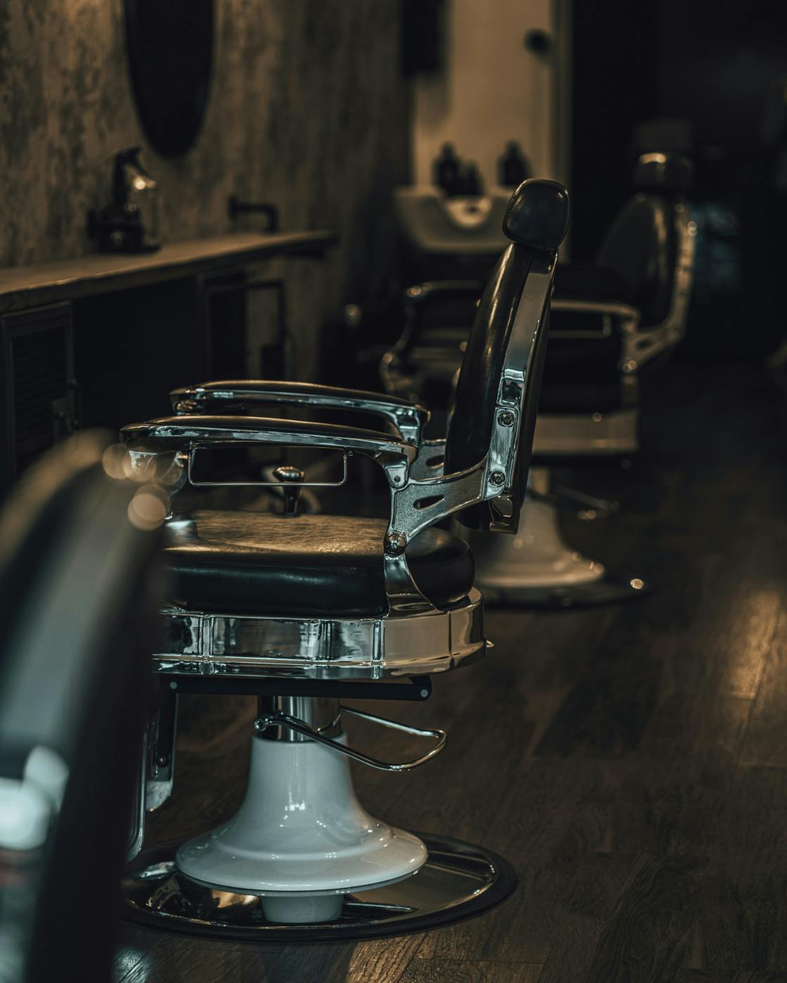 A black and silver classic barber chair