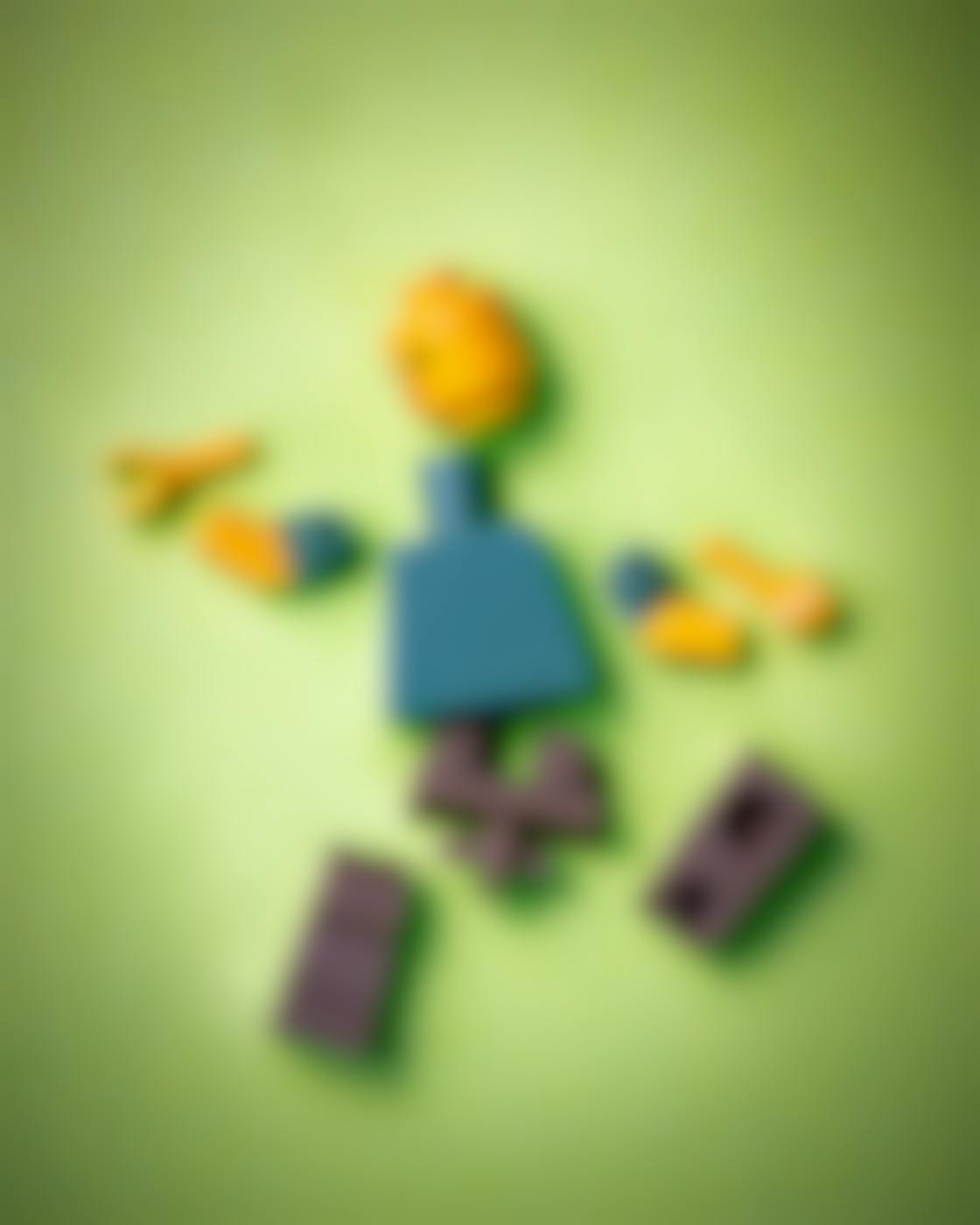 A Lego person in pieces