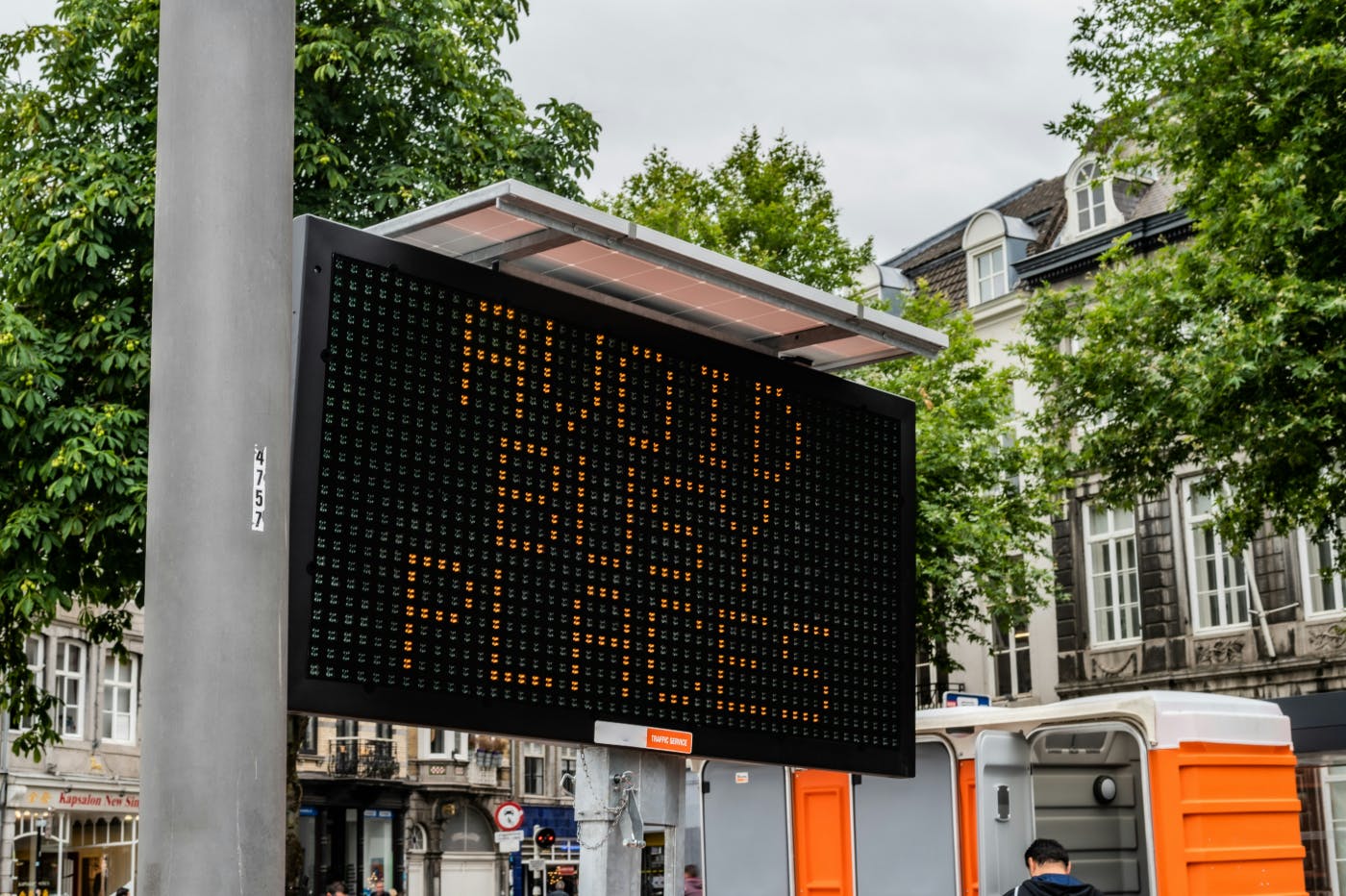 A lighted street sign reading Avoid Busy Places
