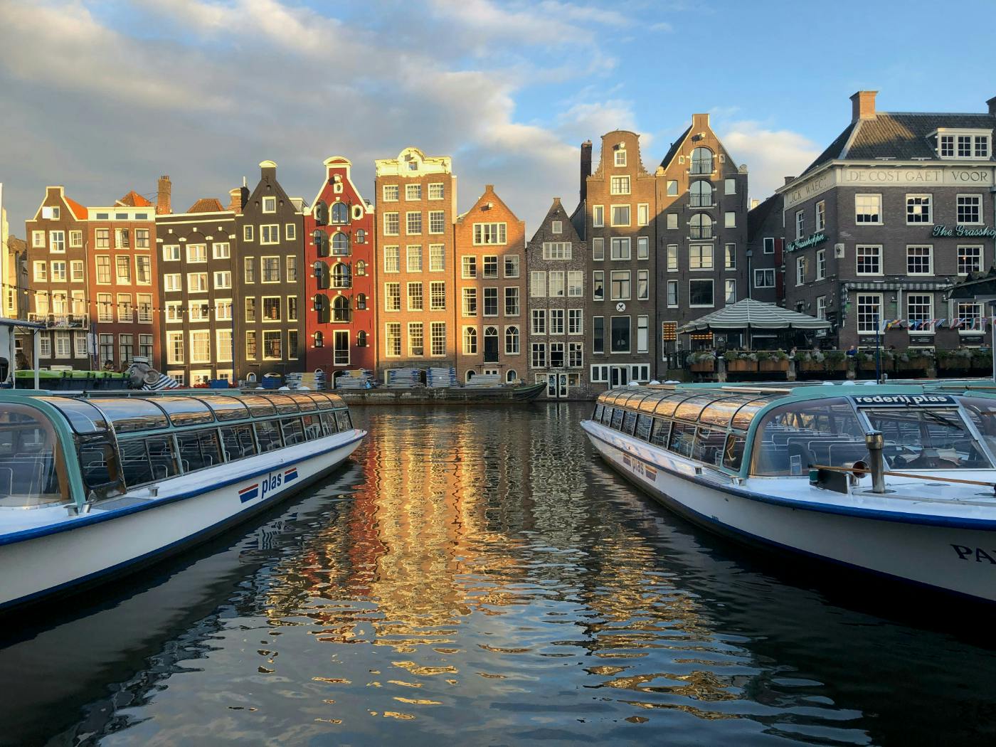 The golden sunlit waterfront in Amsterdam