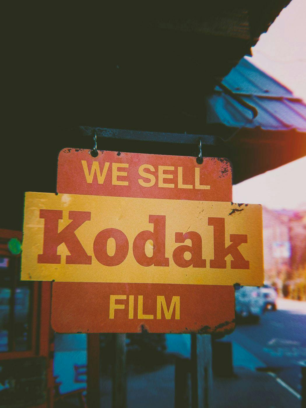 A sign for Kodak outside a shop