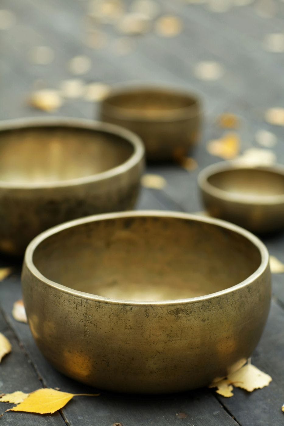 4 different sized brass singing bowls