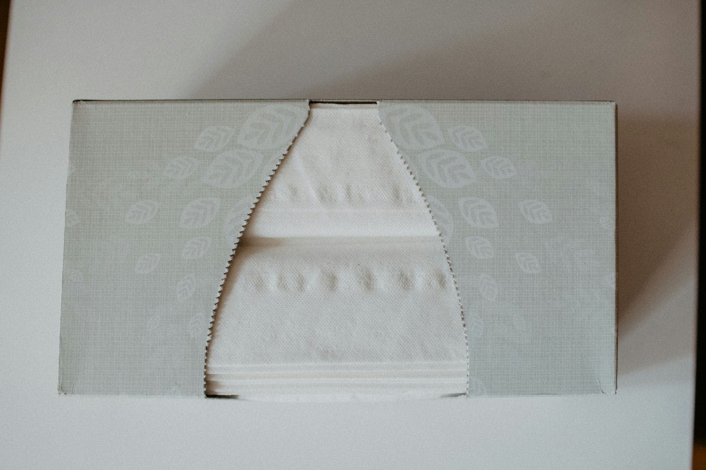 a gray box of facial tissues