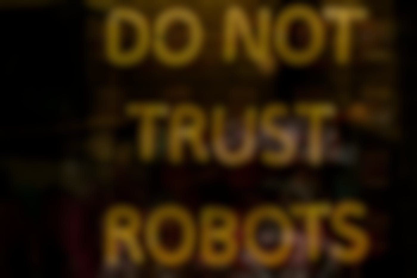 A yellow neon sign reading Do Not Trust Robots