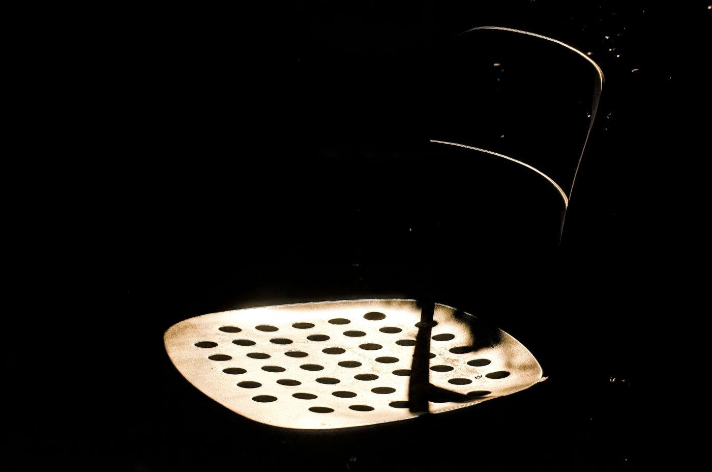 A empty chair in a dark room