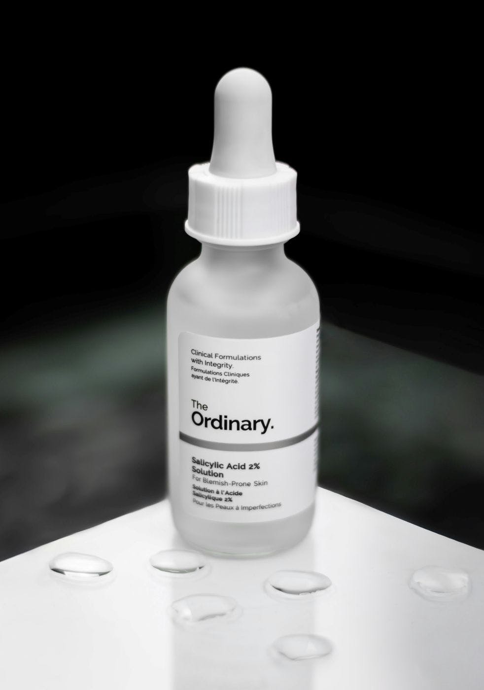 A bottle with an eye dropped and a lable reading The Ordinary