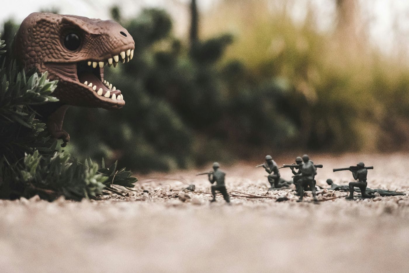 Green Army Men fighting a dinosaur