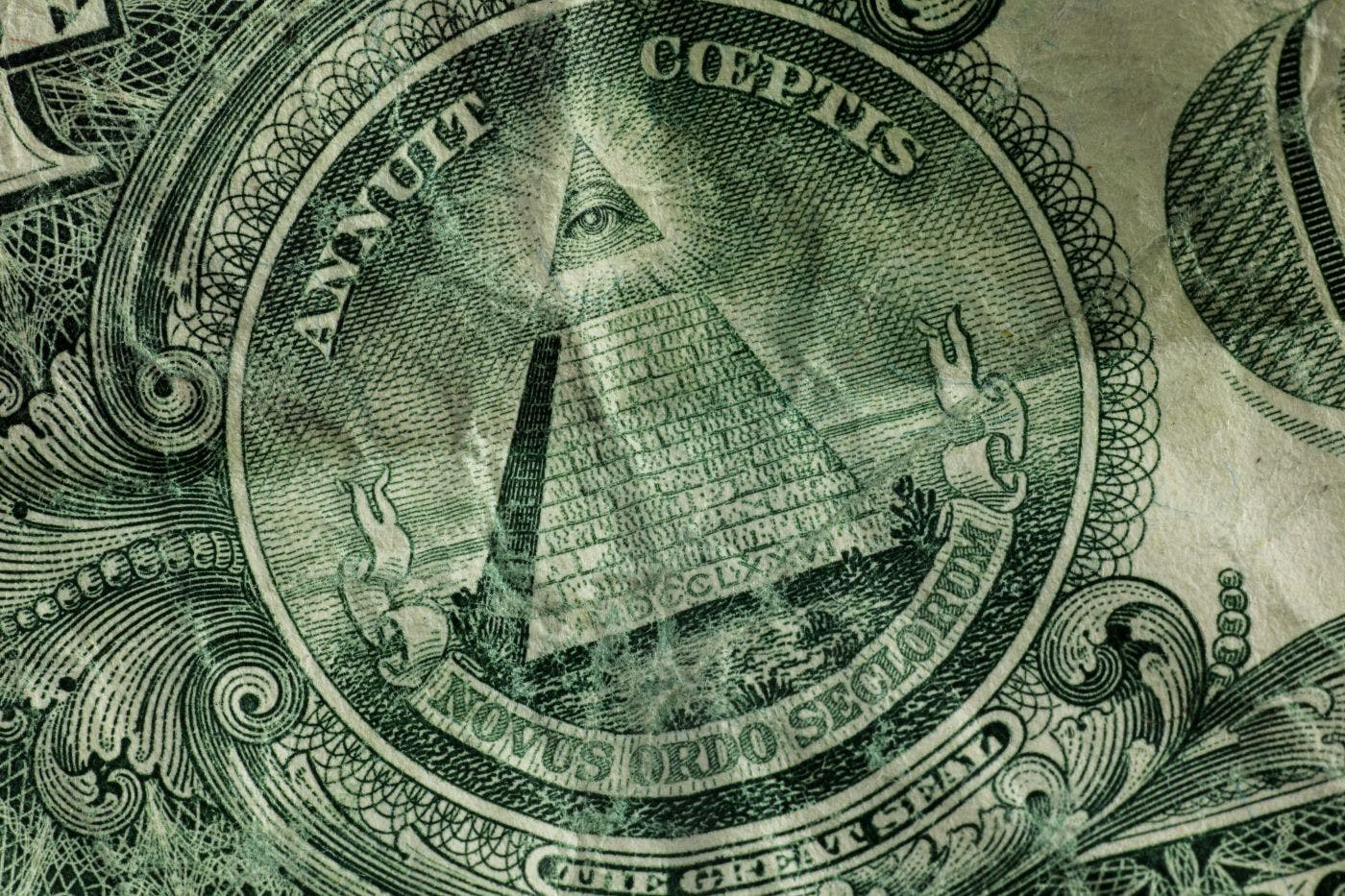 The pyramid with the eye above it on the back of a one dollar bill