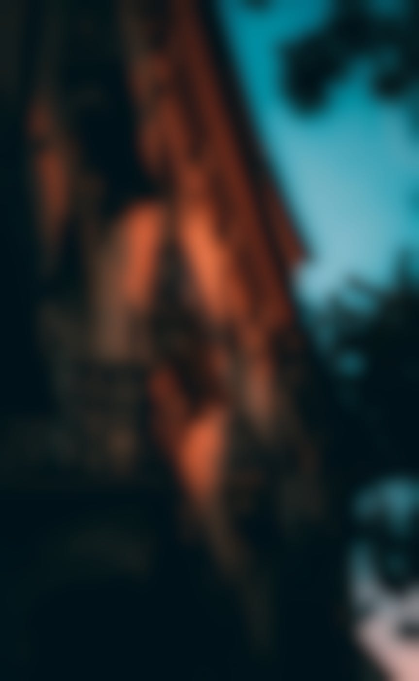 An old building with balconies in sunset