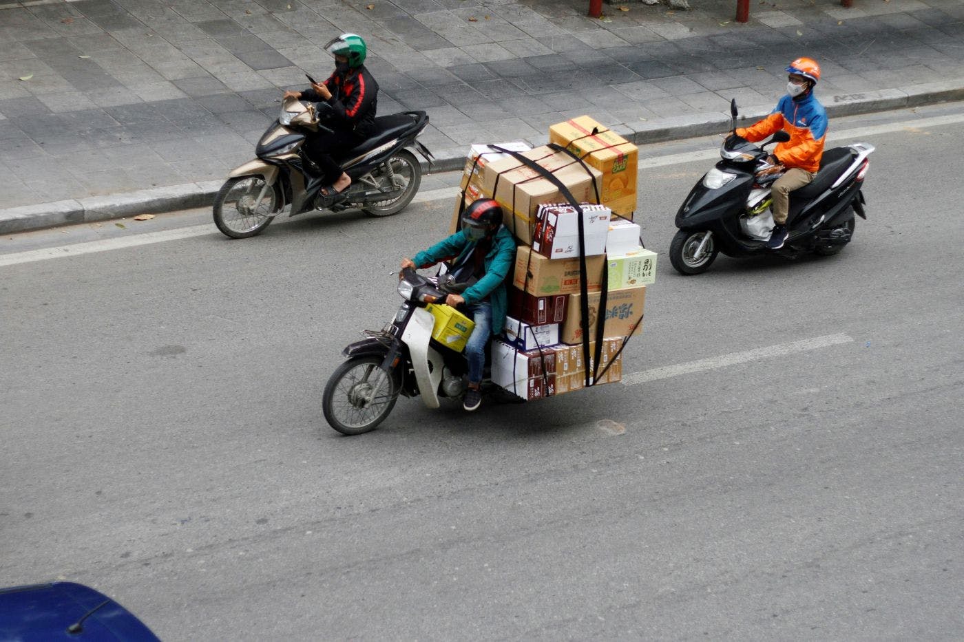 A motorcyclist carrying an insane number of packages