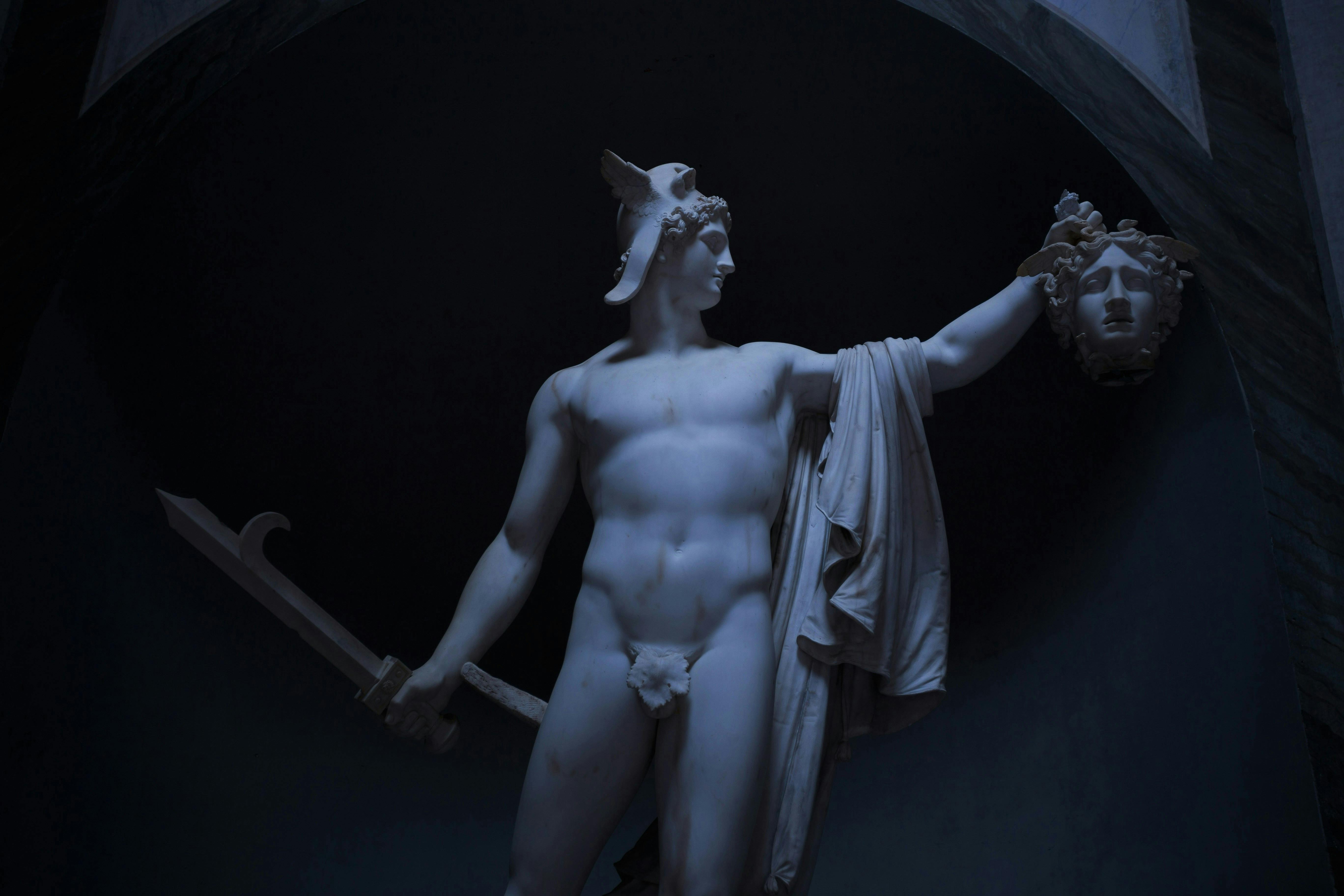 A statue of Perseus holding Medusa's head