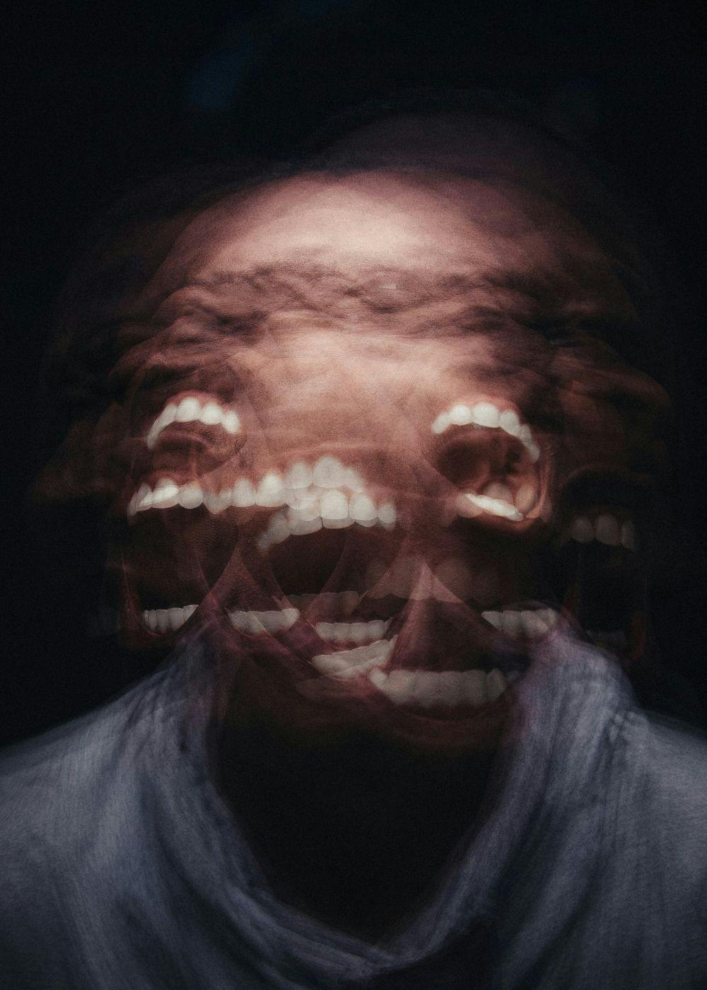 Multiple exposures of a man screaming