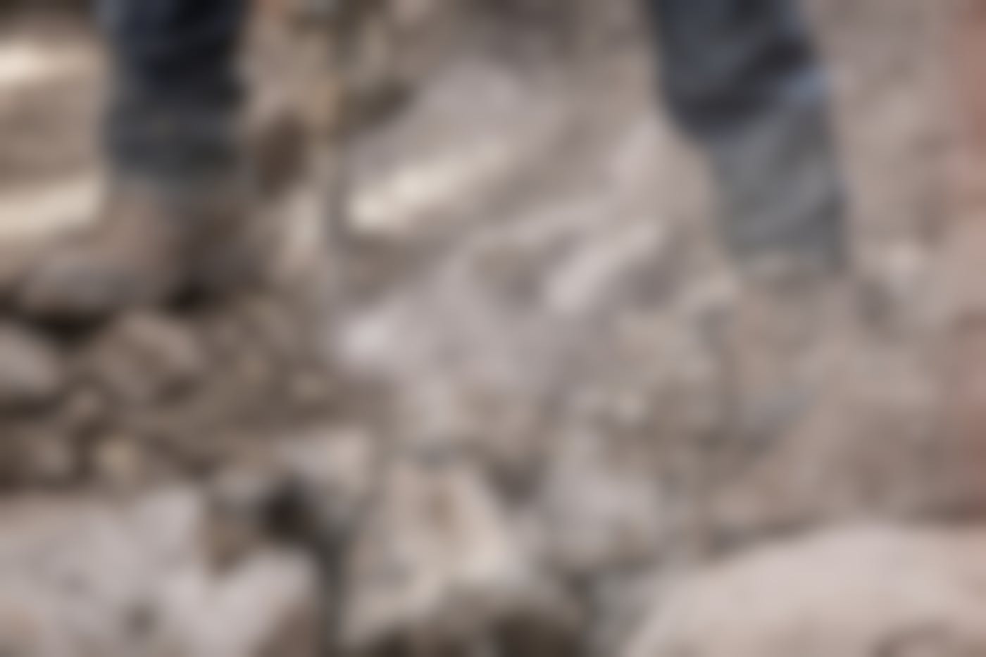 A worker using a jack hammer