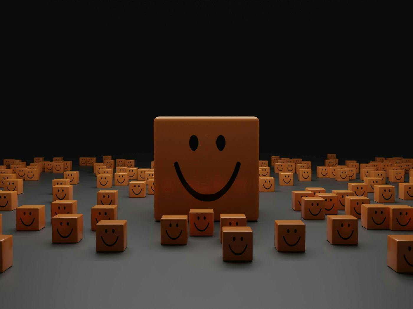 A big square smiley face surrounded by small square smiley faces