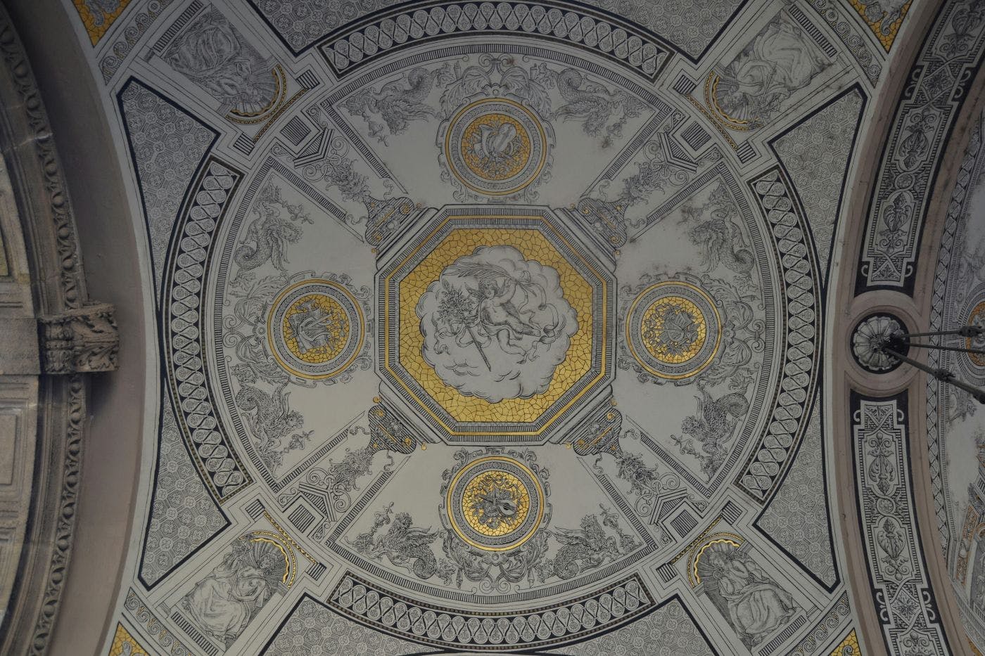 An ornate silver and gold ceiling