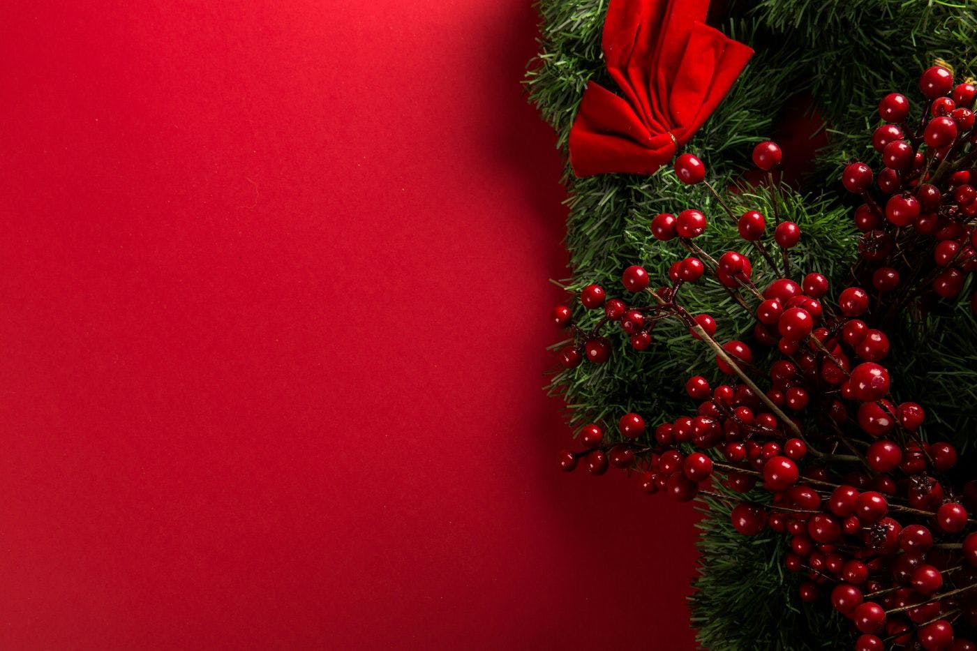 A Christmas wreath on red background
