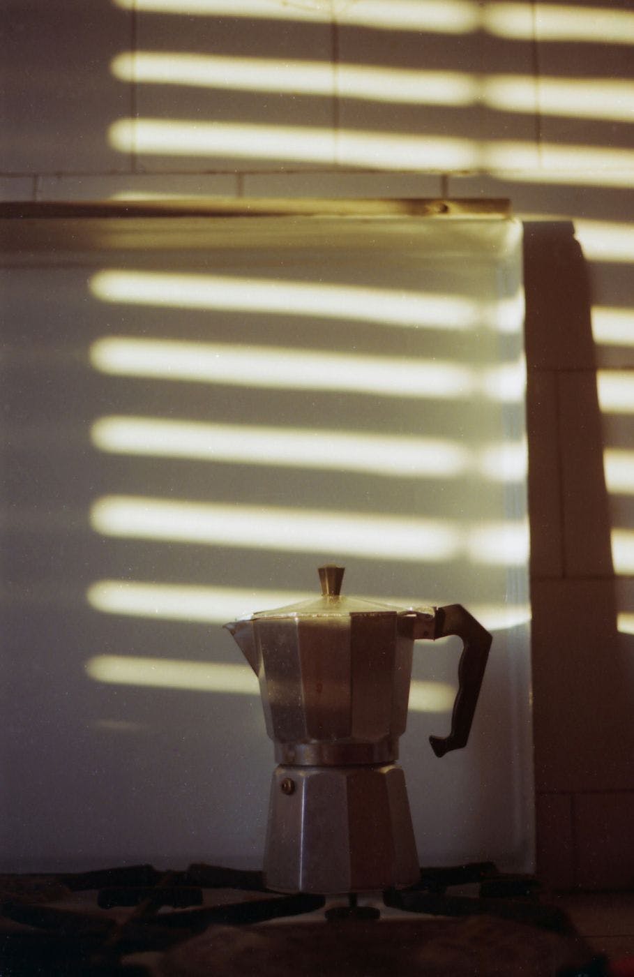 An espresso percolator on a stove