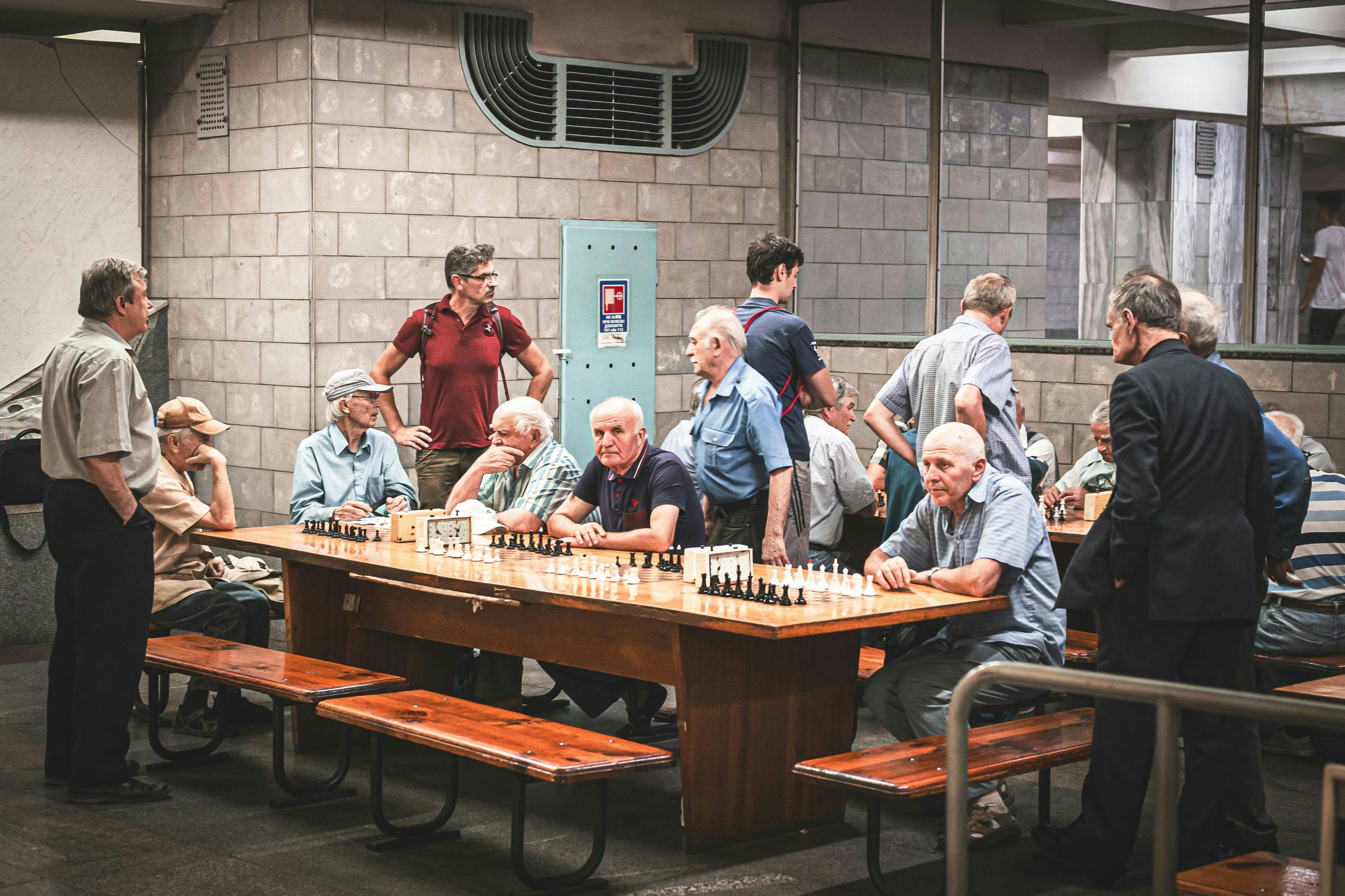 A bunch of older men at a chess tournament