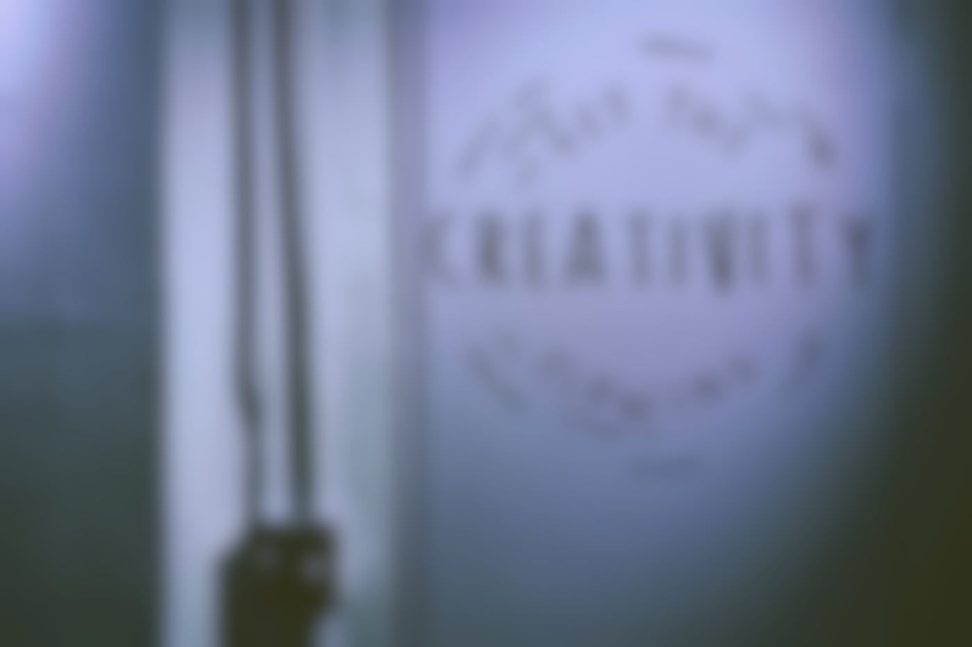 A white wall with Get The Creativity Flowing painted on it