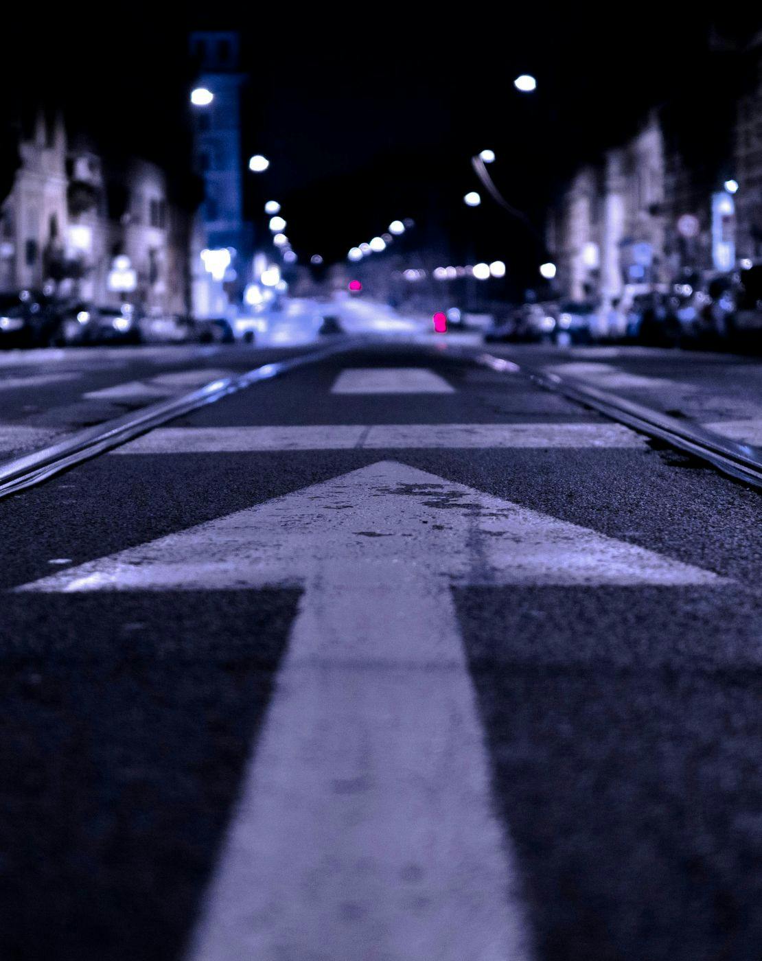 Shallow focus of an arrow on a road