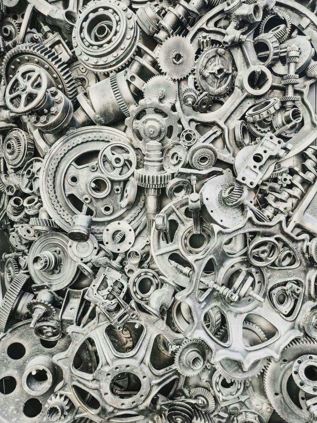 Black and white image of hundreds of machine parts