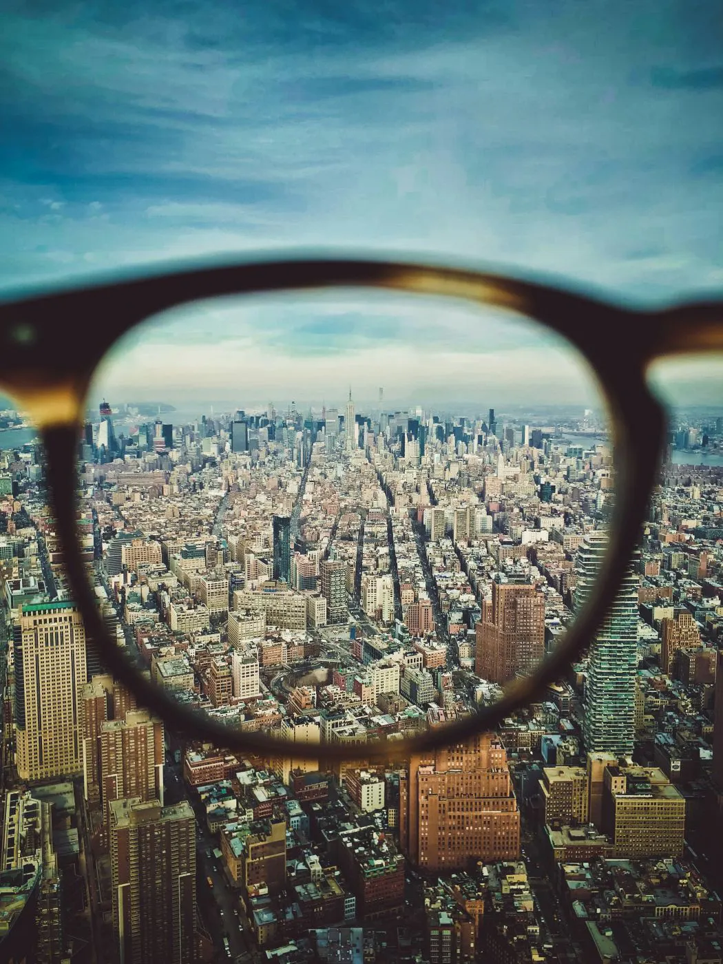 A city viewed through one lens of eyeglasses