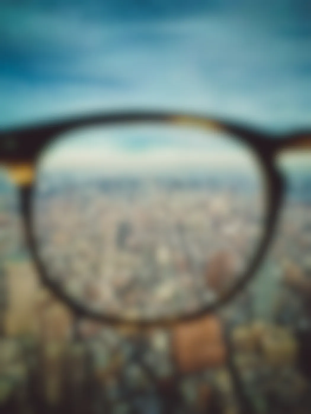 A city viewed through one lens of eyeglasses