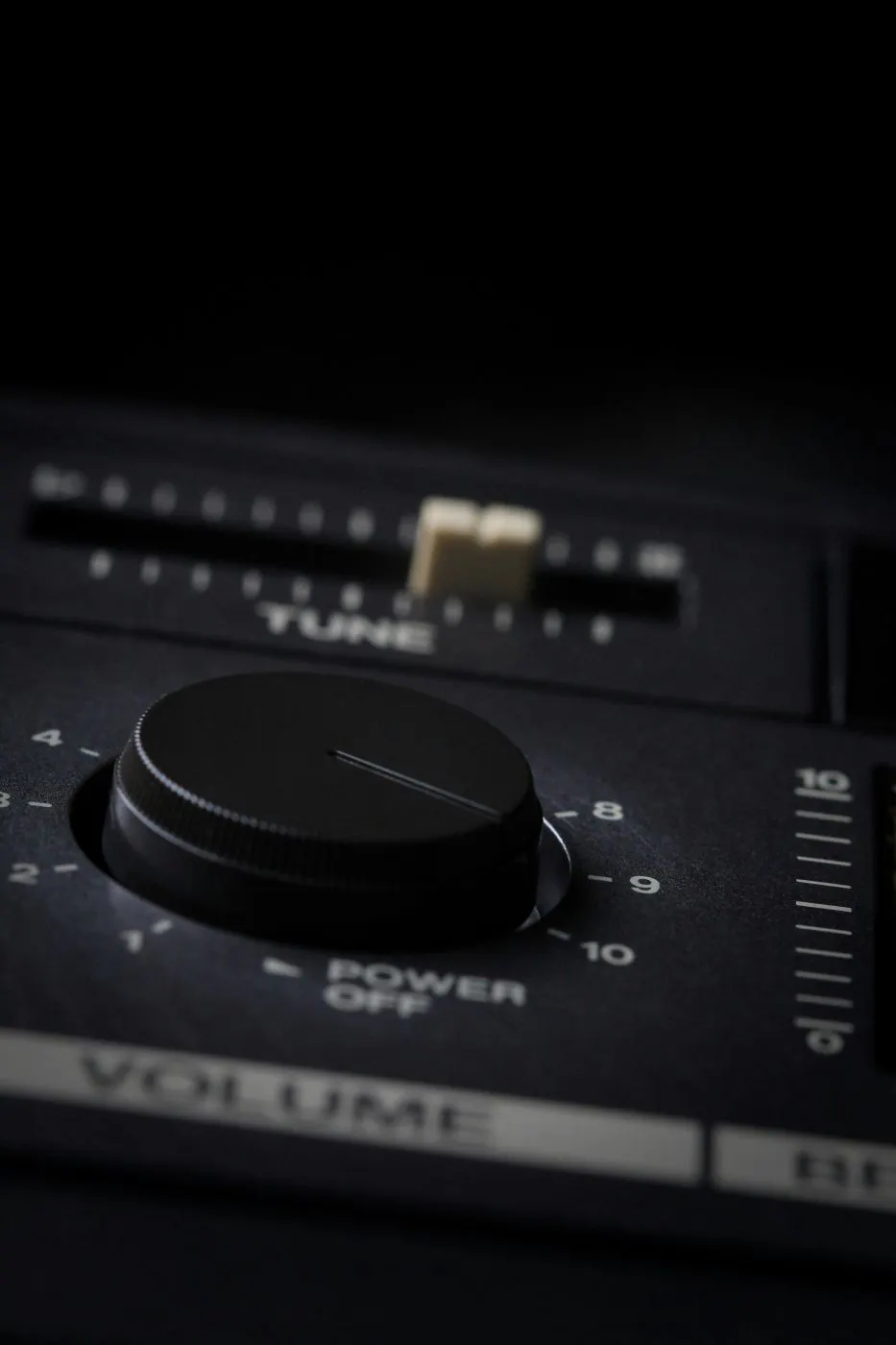 The volume knob on a mixing board turned up to ten