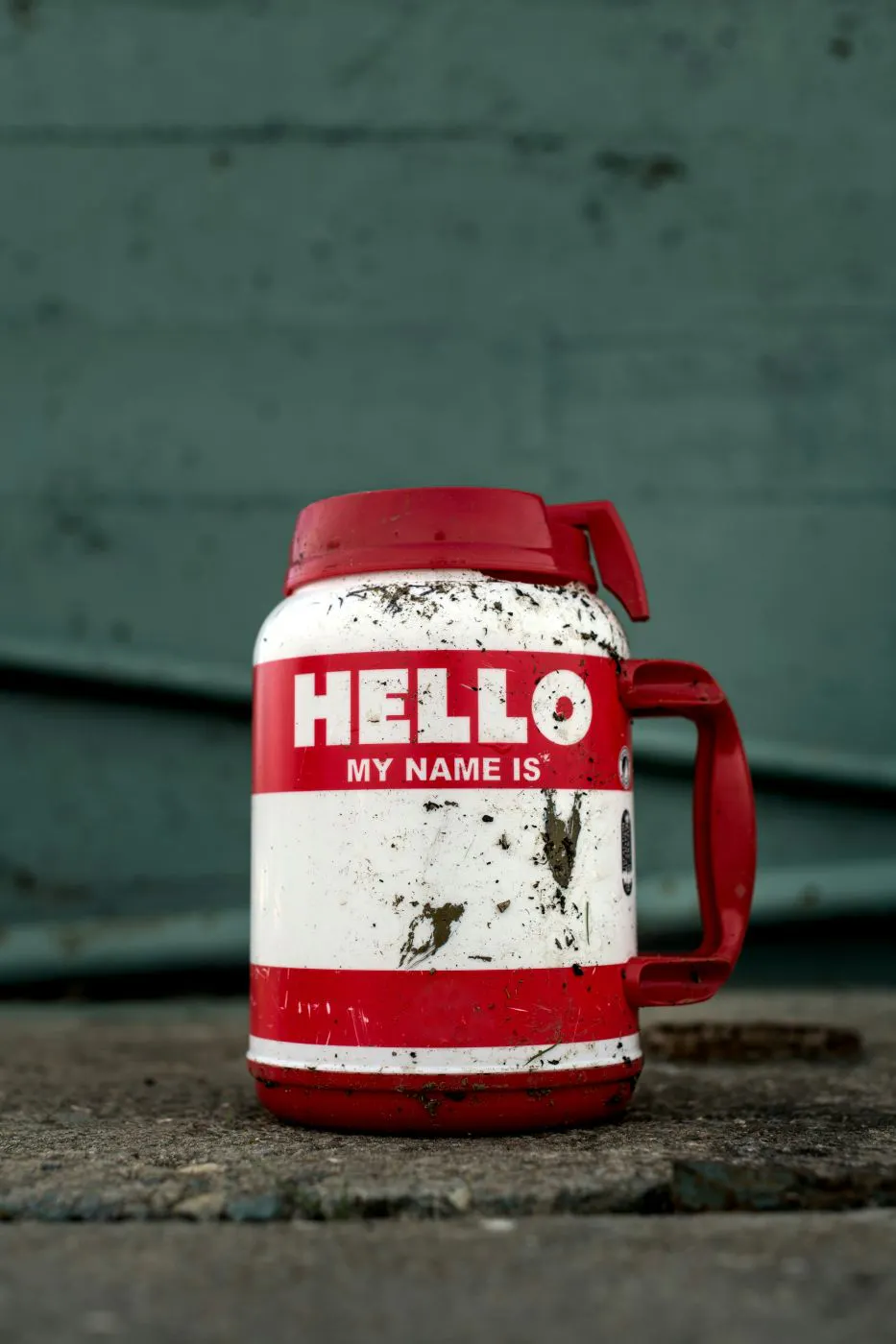 A large red and white travel tumbler with Hello! My Name Is ... on it