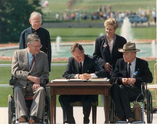 George bush signing the ada act