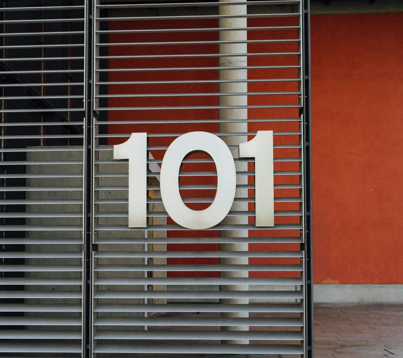 A slat window with the number 101 on it